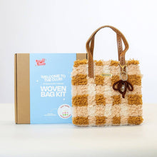 Load image into Gallery viewer, Contents of the Chocolate Gingham woven tote bag kit: feather yarn, plastic canvas, straps and tools.