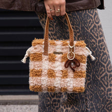Load image into Gallery viewer, Chocolate Gingham woven tote bag being carried as a handbag.