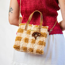Load image into Gallery viewer, Chocolate Gingham woven tote bag being carried as a handbag.