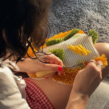 Load image into Gallery viewer, Delightful Daisies rug being made with a latch hook tool.