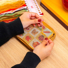 Load image into Gallery viewer, Close-up of autumn needlepoint stitches on the Fall Harvest Charms pouch.