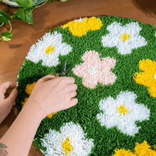 Load image into Gallery viewer, Close-up of soft latch hook yarn flowers on the Flower Bomb Green rug.