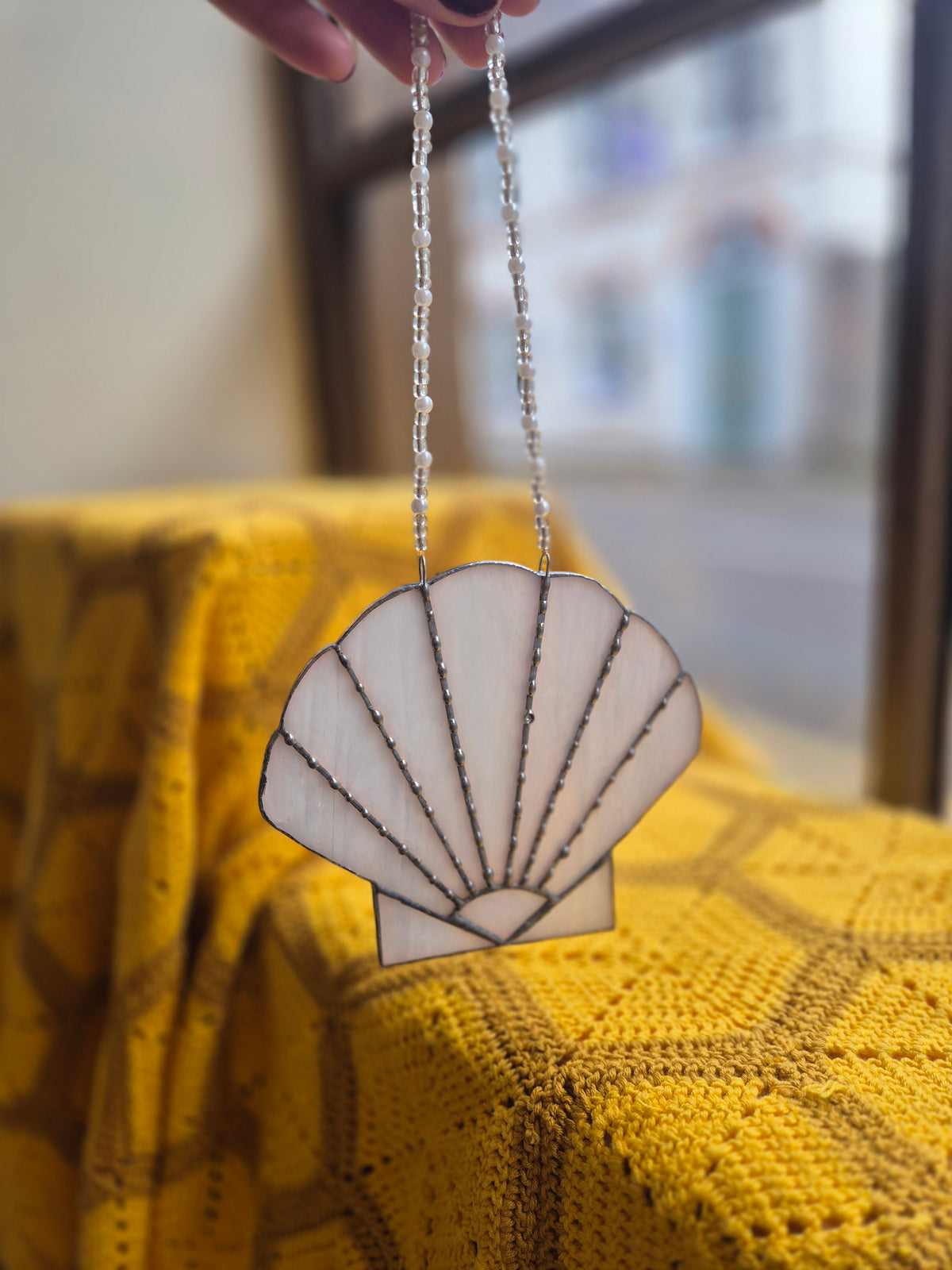 Iridescent shell stained glass suncatcher by Gobblin Glass