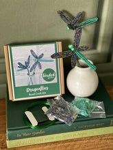 Load image into Gallery viewer, Contents of the iris dragonflies bead craft kit: iridescent and teal glass beads, wire, floristry tape and instructions.