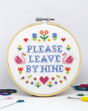 Load image into Gallery viewer, Finished Please Leave by Nine cross stitch in a wooden hoop with swans, flowers and hearts