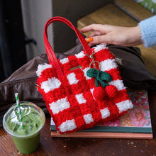 Load image into Gallery viewer, Red Gingham woven tote bag being carried as a handbag.