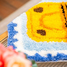 Load image into Gallery viewer, Close-up of blue latch hook yarn texture on the Sardine Stamp rug.