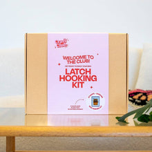 Load image into Gallery viewer, Contents of the Sardine Stamp rug making kit with pre-backed rug base and yarn.