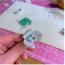 Load image into Gallery viewer, Close-up of a beaded snowdrop flower showing white seed bead petals.