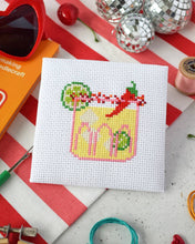 Load image into Gallery viewer, Spicy Margarita mini cross stitch kit by The Make Arcade, a finished margarita with lime slices and a red chilli