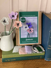 Load image into Gallery viewer, Contents of the anemone beaded flower kit: seed beads, wire, floristry tape and instructions.
