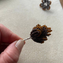 Load image into Gallery viewer, Contents of the Christmas beaded decoration kit: seed beads, glass pearls, wire and hanging thread.
