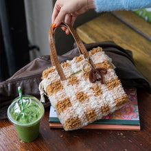 Load image into Gallery viewer, Chocolate Gingham woven tote bag being carried as a handbag.
