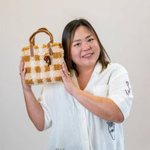 Load image into Gallery viewer, Chocolate Gingham woven tote bag being carried as a handbag.
