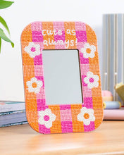 Load image into Gallery viewer, Finished Cute As Always diamond painting mirror frame in pink and orange gingham with white flowers on a desk
