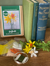 Load image into Gallery viewer, Contents of the daffodil beaded flower kit: seed beads, wire, floristry tape and instructions.
