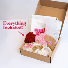 Load image into Gallery viewer, Contents of the Red Gingham woven tote bag kit: feather yarn, plastic canvas, gold hardware and tools.
