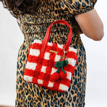 Load image into Gallery viewer, Red Gingham woven tote bag being carried as a handbag.
