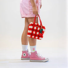 Load image into Gallery viewer, Red Gingham woven tote bag being carried as a handbag.
