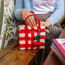Load image into Gallery viewer, Red Gingham woven tote bag being carried as a handbag.
