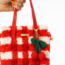 Load image into Gallery viewer, Cherry keychain on the Red Gingham woven tote bag.
