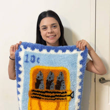 Load image into Gallery viewer, Contents of the Sardine Stamp rug making kit with pre-backed rug base and yarn.
