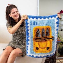 Load image into Gallery viewer, Finished Sardine Stamp latch hook rug with a blue sardine tin design by Craft Club.
