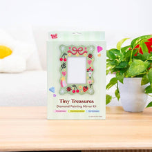 Load image into Gallery viewer, Contents of the Tiny Treasures diamond painting kit: adhesive frame, gems, applicator, tray and gold stand.
