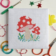 Load image into Gallery viewer, Finished red toadstool mini cross stitch by The Make Arcade.
