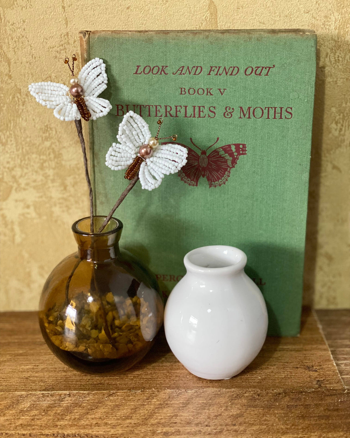 White beaded butterflies displayed as home décor