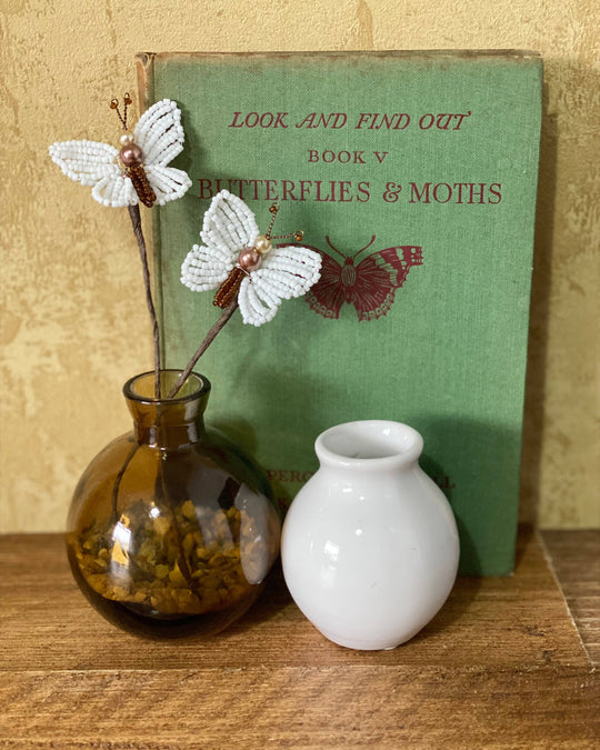 White beaded butterflies displayed as home décor